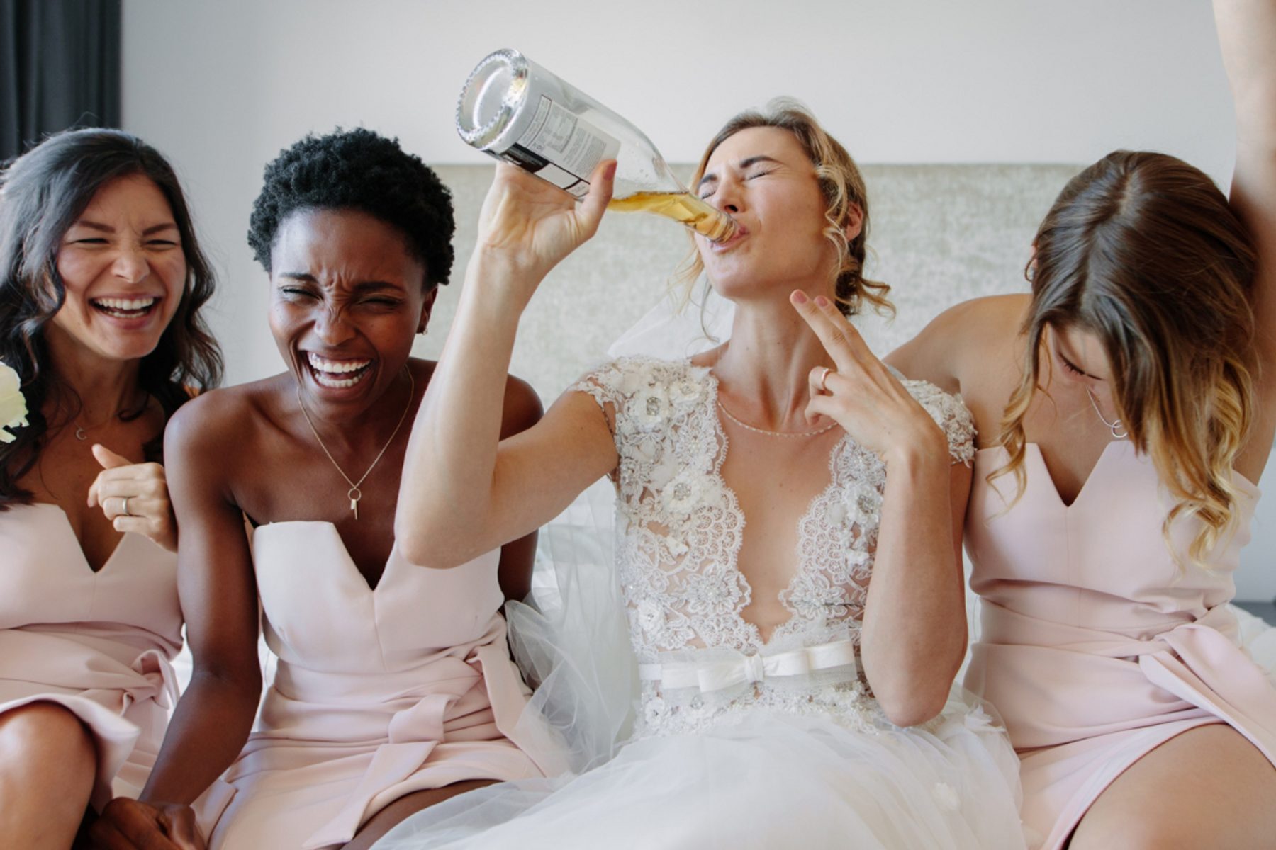 The bridal party laughing together