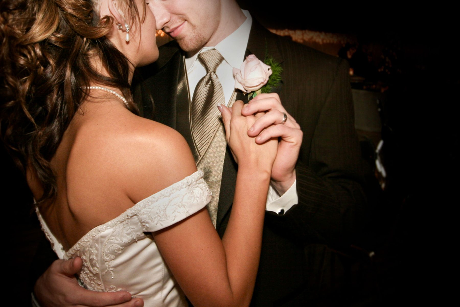 The first dance on a low lit dance floor