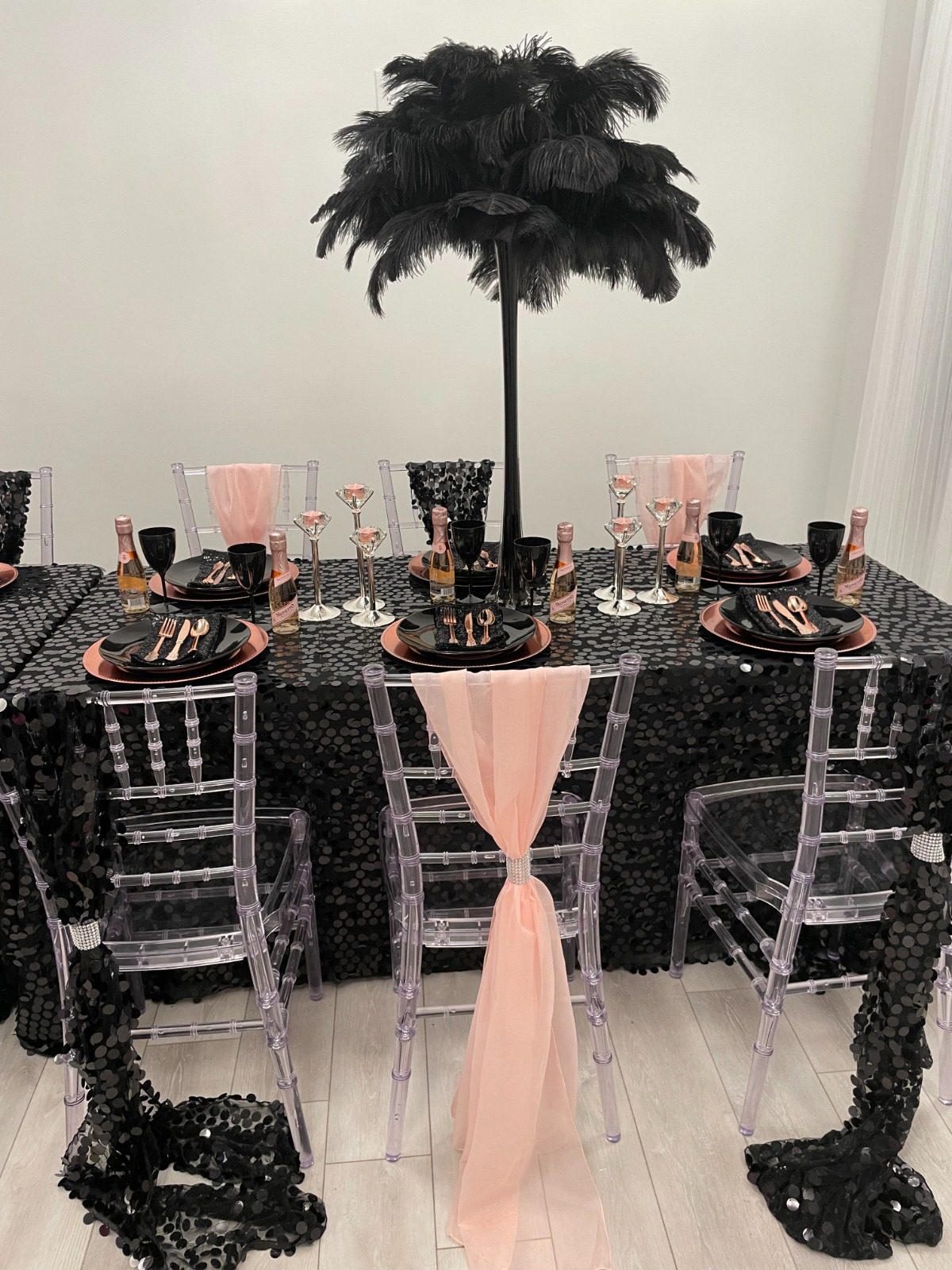 Black sequin and blush tablescape with tall feather centerpieces