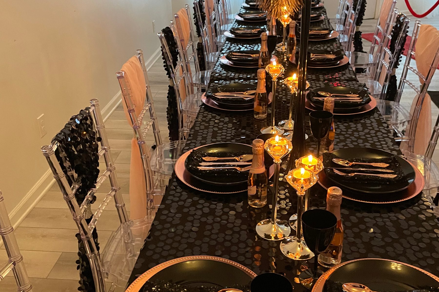 Gold candlesticks and low florals down a dinner table