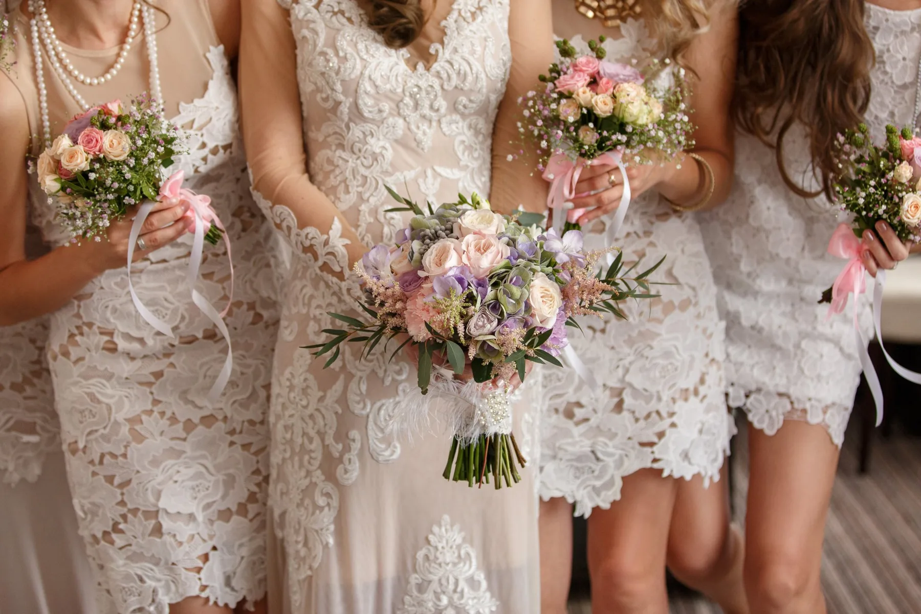 Bridal party and bride holding bouquets